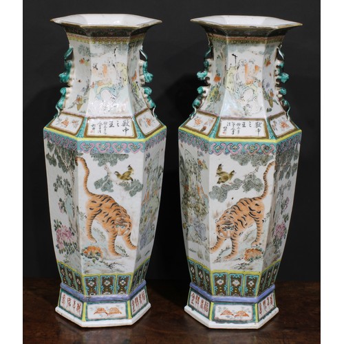 428 - A pair of Chinese hexagonal vases, painted in polychrome with tigers, water buffalo and other animal... 