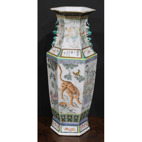 428 - A pair of Chinese hexagonal vases, painted in polychrome with tigers, water buffalo and other animal... 