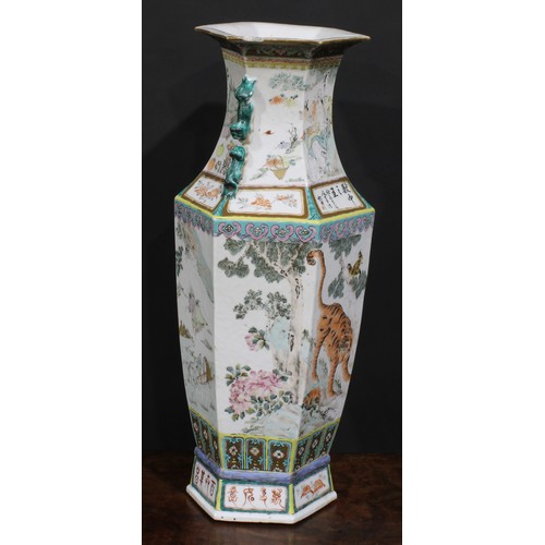 428 - A pair of Chinese hexagonal vases, painted in polychrome with tigers, water buffalo and other animal... 