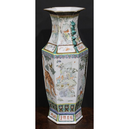 428 - A pair of Chinese hexagonal vases, painted in polychrome with tigers, water buffalo and other animal... 