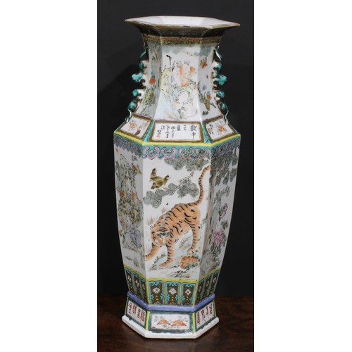 428 - A pair of Chinese hexagonal vases, painted in polychrome with tigers, water buffalo and other animal... 