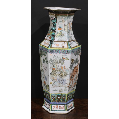 428 - A pair of Chinese hexagonal vases, painted in polychrome with tigers, water buffalo and other animal... 