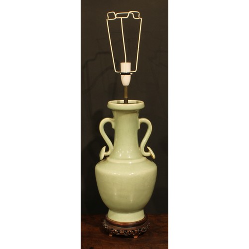 355 - A pair of Chinese celadon ovoid vases, fitted as table lamps, ruyi sceptre handles, hardwood bases, ... 