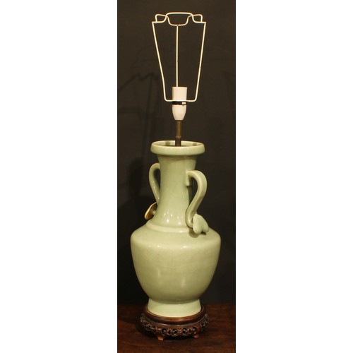 355 - A pair of Chinese celadon ovoid vases, fitted as table lamps, ruyi sceptre handles, hardwood bases, ... 