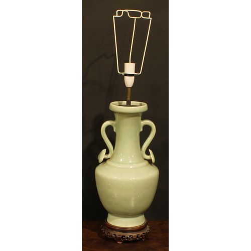 355 - A pair of Chinese celadon ovoid vases, fitted as table lamps, ruyi sceptre handles, hardwood bases, ... 