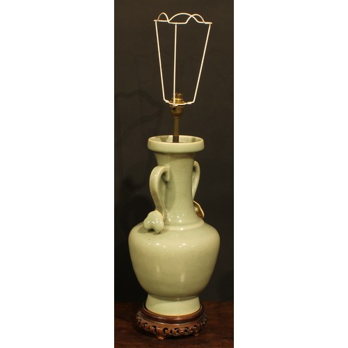 355 - A pair of Chinese celadon ovoid vases, fitted as table lamps, ruyi sceptre handles, hardwood bases, ... 