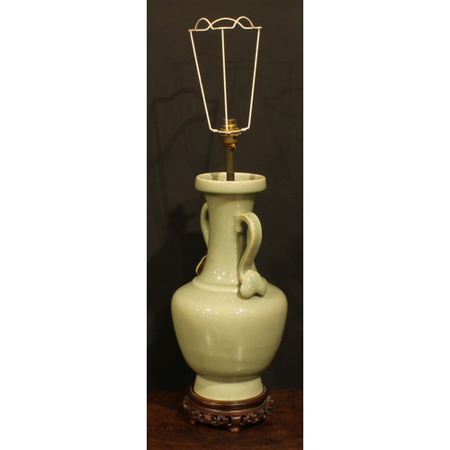 355 - A pair of Chinese celadon ovoid vases, fitted as table lamps, ruyi sceptre handles, hardwood bases, ... 