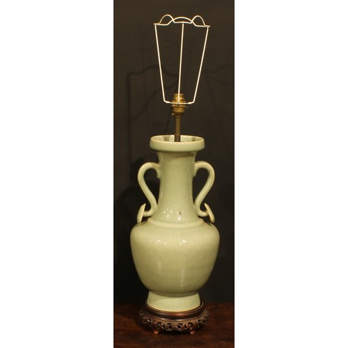 355 - A pair of Chinese celadon ovoid vases, fitted as table lamps, ruyi sceptre handles, hardwood bases, ... 