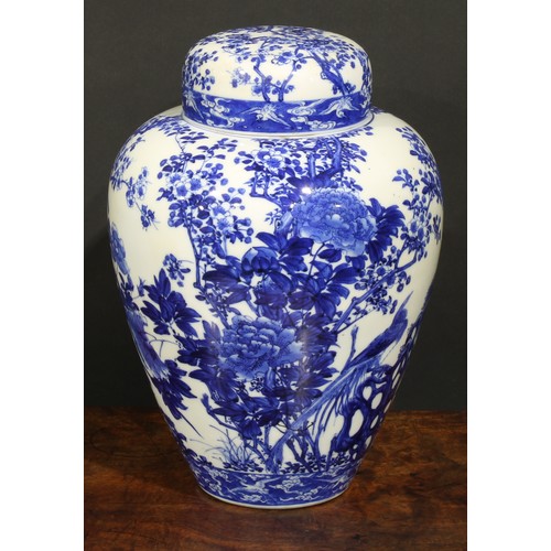 421 - A Japanese porcelain ovoid ginger jar and cover, painted in tones of underglaze blue with the Three ... 