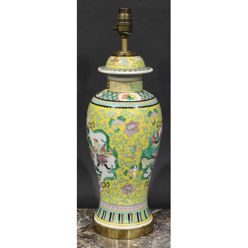 411 - A Chinese ovoid vase, mounted as a lamp, decoarted in polychrome enamels with figures of the court, ... 