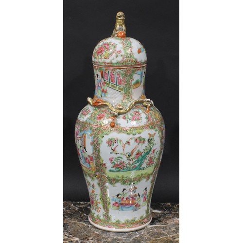 352 - A pair of Cantonese baluster vases and covers, painted in the famille rose palette with figures, bir... 