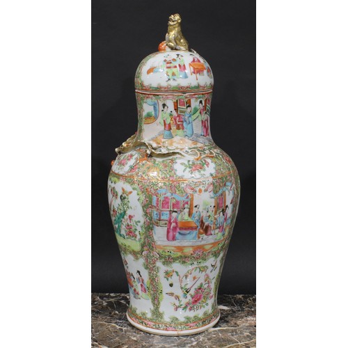 352 - A pair of Cantonese baluster vases and covers, painted in the famille rose palette with figures, bir... 