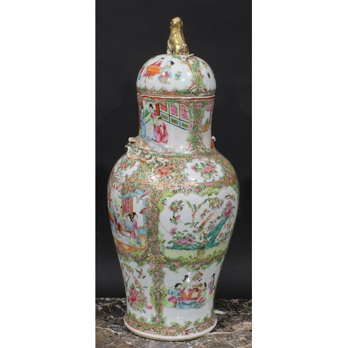 352 - A pair of Cantonese baluster vases and covers, painted in the famille rose palette with figures, bir... 