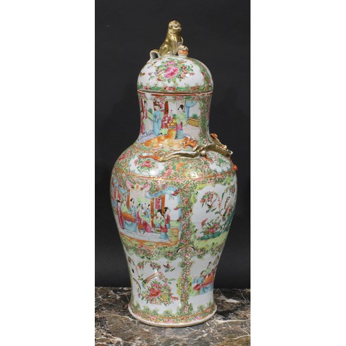 352 - A pair of Cantonese baluster vases and covers, painted in the famille rose palette with figures, bir... 