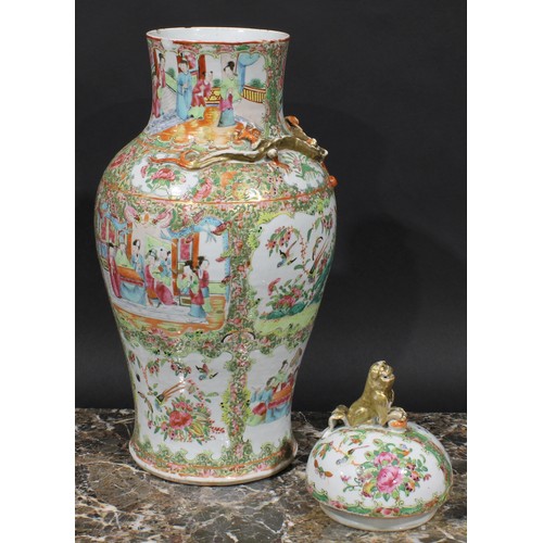 352 - A pair of Cantonese baluster vases and covers, painted in the famille rose palette with figures, bir... 