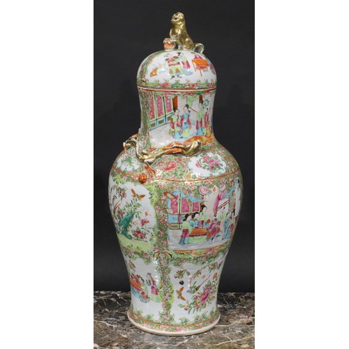 352 - A pair of Cantonese baluster vases and covers, painted in the famille rose palette with figures, bir... 