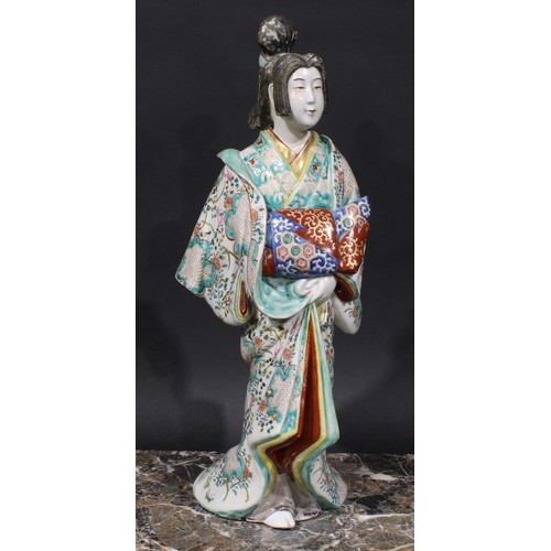 465 - A Japanese porcelain figure, of a lady in a kimono, 46cm high, Meiji period