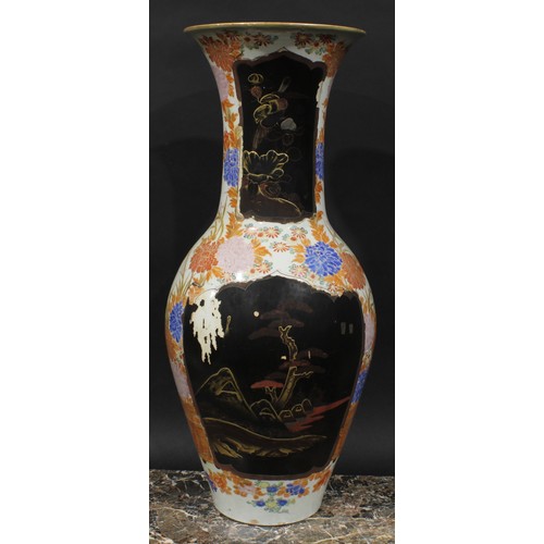 347 - A large Japanese porcelain ovoid vase, decorated with lacquer panels on a ground of flowers and foli... 