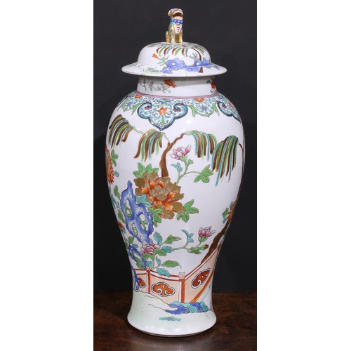 257 - A large 19th century famille rose ovoid vase and cover, painted in in polychrome enamels with flower... 