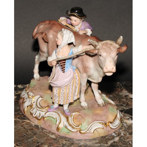 260 - A Meissen porcelain figure group, of a boy and girl with a bull, 22cm wide, incised R78, numbered 53... 