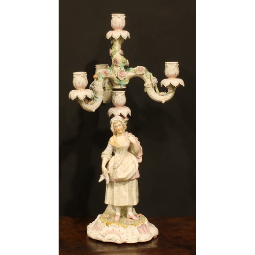 265 - A pair of Continental porcelain four-light table candelabra, figural bases, the branches encrusted w... 