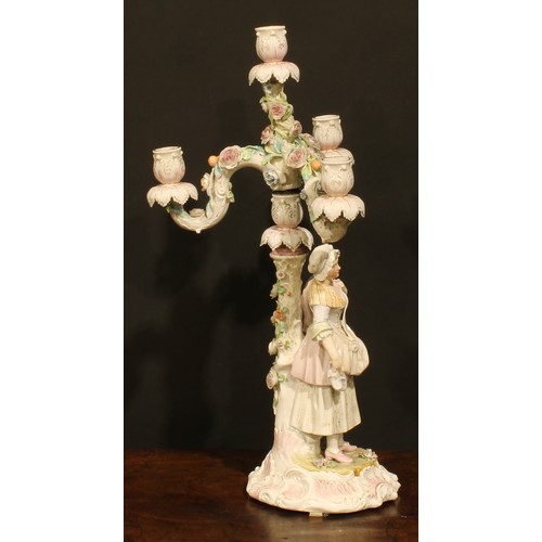 265 - A pair of Continental porcelain four-light table candelabra, figural bases, the branches encrusted w... 