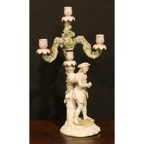 265 - A pair of Continental porcelain four-light table candelabra, figural bases, the branches encrusted w... 