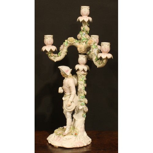 265 - A pair of Continental porcelain four-light table candelabra, figural bases, the branches encrusted w... 