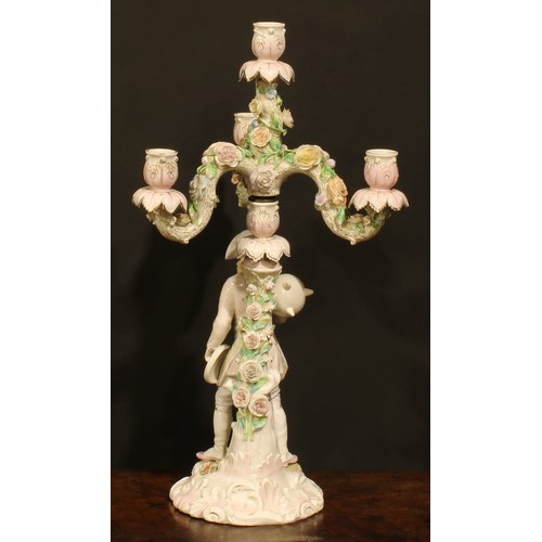 265 - A pair of Continental porcelain four-light table candelabra, figural bases, the branches encrusted w... 