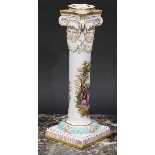 268 - A pair of Meissen columnar candlesticks, each moulded with masks and painted with a courting couple,... 