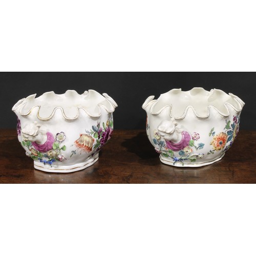 264 - A pair of 19th century Continental porcelain Monteiths, painted with Deutsche blumen, figural handle... 