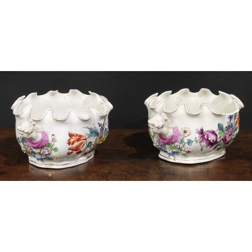 264 - A pair of 19th century Continental porcelain Monteiths, painted with Deutsche blumen, figural handle... 