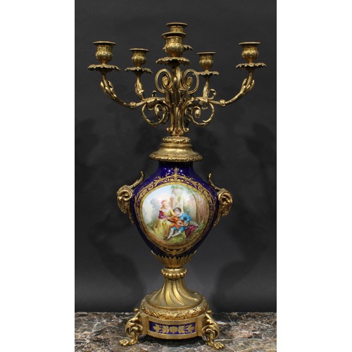 2083 - A pair of 19th century gilt metal and porcelain six light candelabra, acanthus scroll branches, camp... 