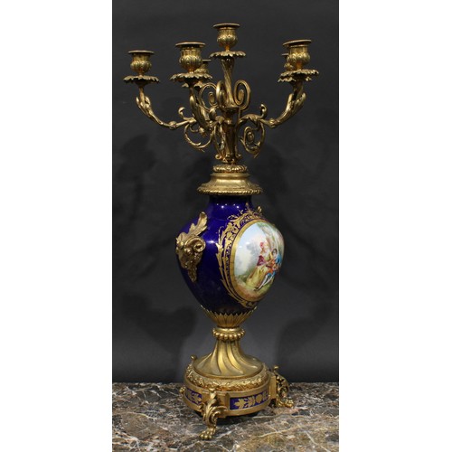 2083 - A pair of 19th century gilt metal and porcelain six light candelabra, acanthus scroll branches, camp... 