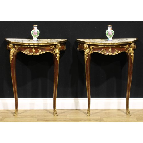 1540 - A pair of Louis XV style gilt metal mounted mahogany console tables, of small proportions, each with... 