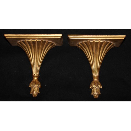 1542 - A pair of Neoclassical Revival giltwood wall brackets, rectangular plateaux, pendant finials, 30.5cm... 