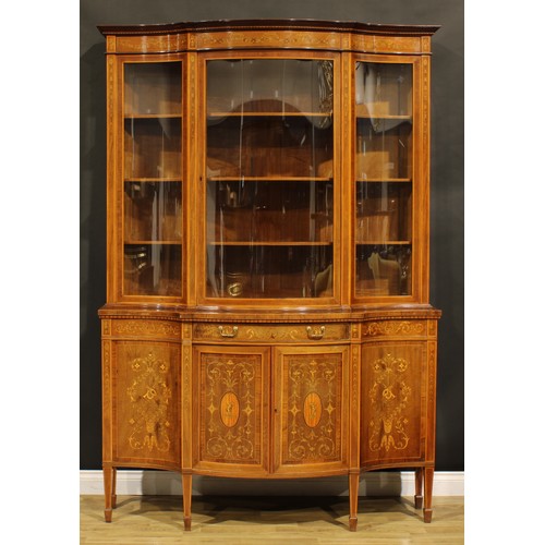 1558 - An Edwardian Sheraton Revival satinwood and rosewood banded mahogany and marquetry shaped serpentine... 