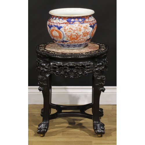 1299 - A Chinese hongmu and mother of pearl marquetry jardiniere stand, shaped circular top with beaded bor... 