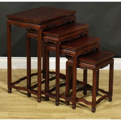 1294 - A Chinese hardwood quartetto nest of occasional tables, rectangular panel tops, humpback stretchers,... 