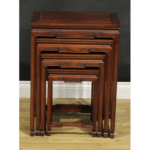 1294 - A Chinese hardwood quartetto nest of occasional tables, rectangular panel tops, humpback stretchers,... 