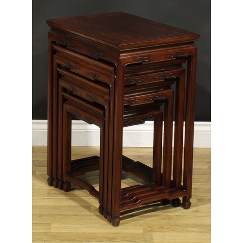 1294 - A Chinese hardwood quartetto nest of occasional tables, rectangular panel tops, humpback stretchers,... 