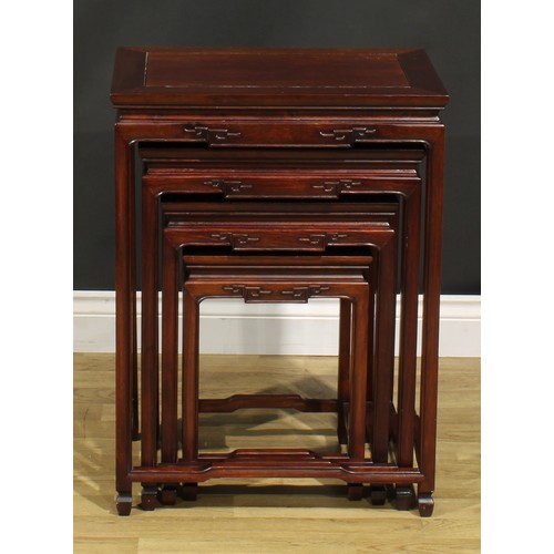 1294 - A Chinese hardwood quartetto nest of occasional tables, rectangular panel tops, humpback stretchers,... 