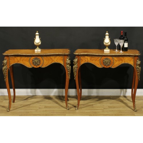 1539 - A pair of Louis XV Revival gilt metal mounted serpentine side tables, each with a crossbanded quarte... 