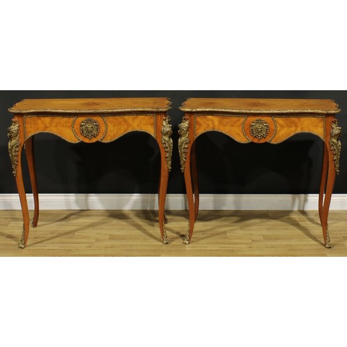 1539 - A pair of Louis XV Revival gilt metal mounted serpentine side tables, each with a crossbanded quarte... 