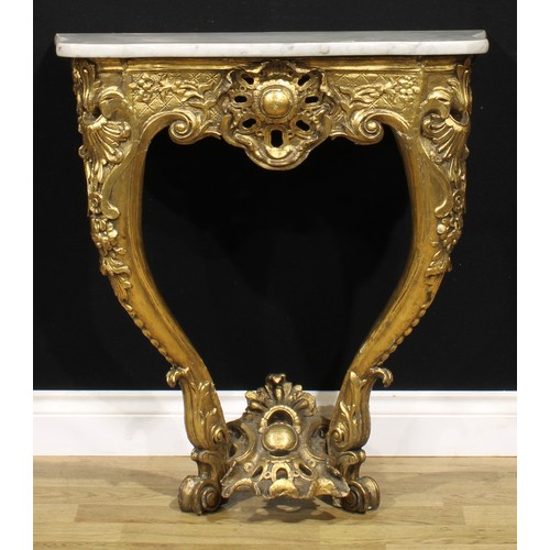 1561 - An Italian giltwood console table, possibly Tuscan, serpentine Carrara marble top, carved throughout... 