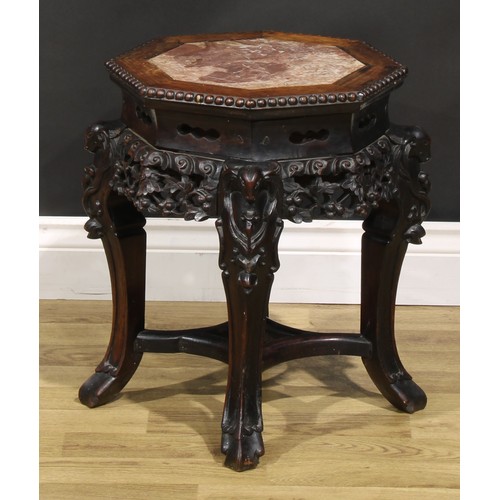 1435 - A Chinese hardwood jardiniere stand, octagonal top with beaded edge and inset marble panel, shaped a... 