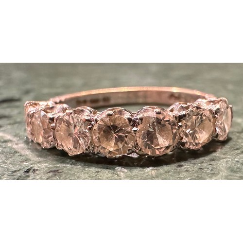 878 - A diamond half eternity ring, linear set with seven round brilliant cut diamonds, total estimated di... 