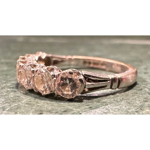 878 - A diamond half eternity ring, linear set with seven round brilliant cut diamonds, total estimated di... 