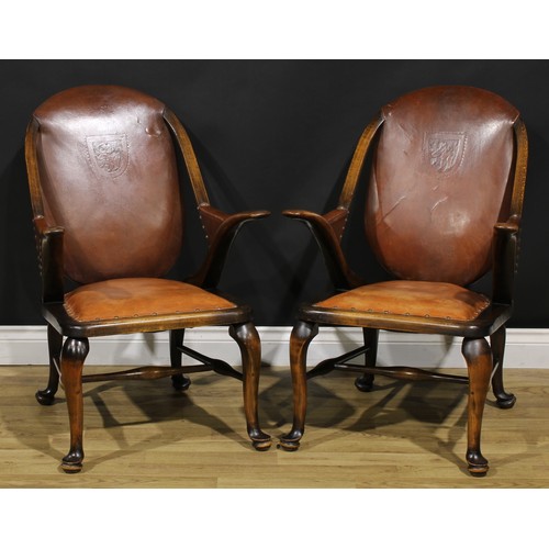 2103 - A pair of Art Deco period beech library club reading chairs, stuffed-over upholstery, the back with ... 