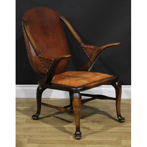 2103 - A pair of Art Deco period beech library club reading chairs, stuffed-over upholstery, the back with ... 